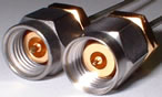 Picture of Male 2.9 mm SMA compatible
connector on left, <br> and male 2.4 mm (NOT SMA compatible) Connector on the right